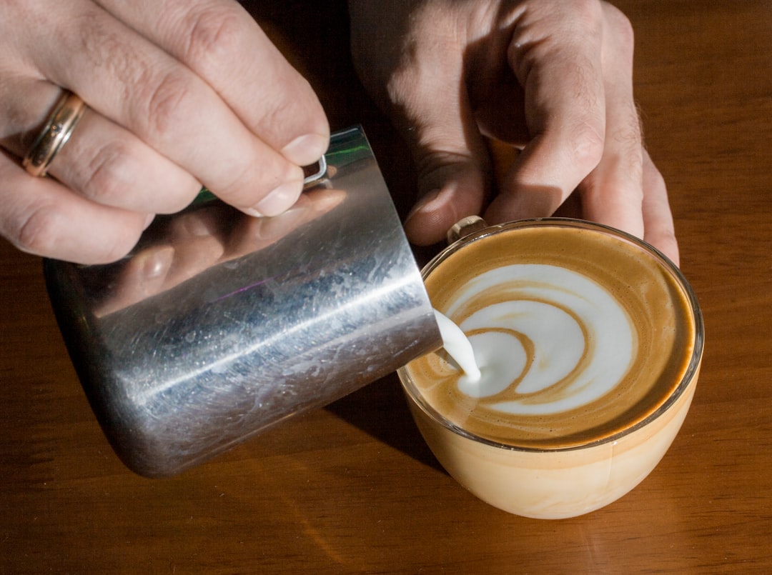 person practicing latte art