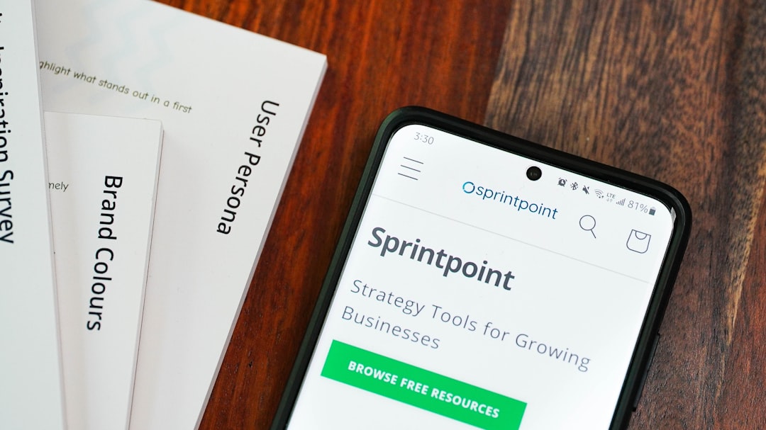 messy desk with laptop and papers