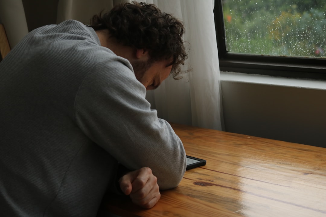 person scrolling phone stressed