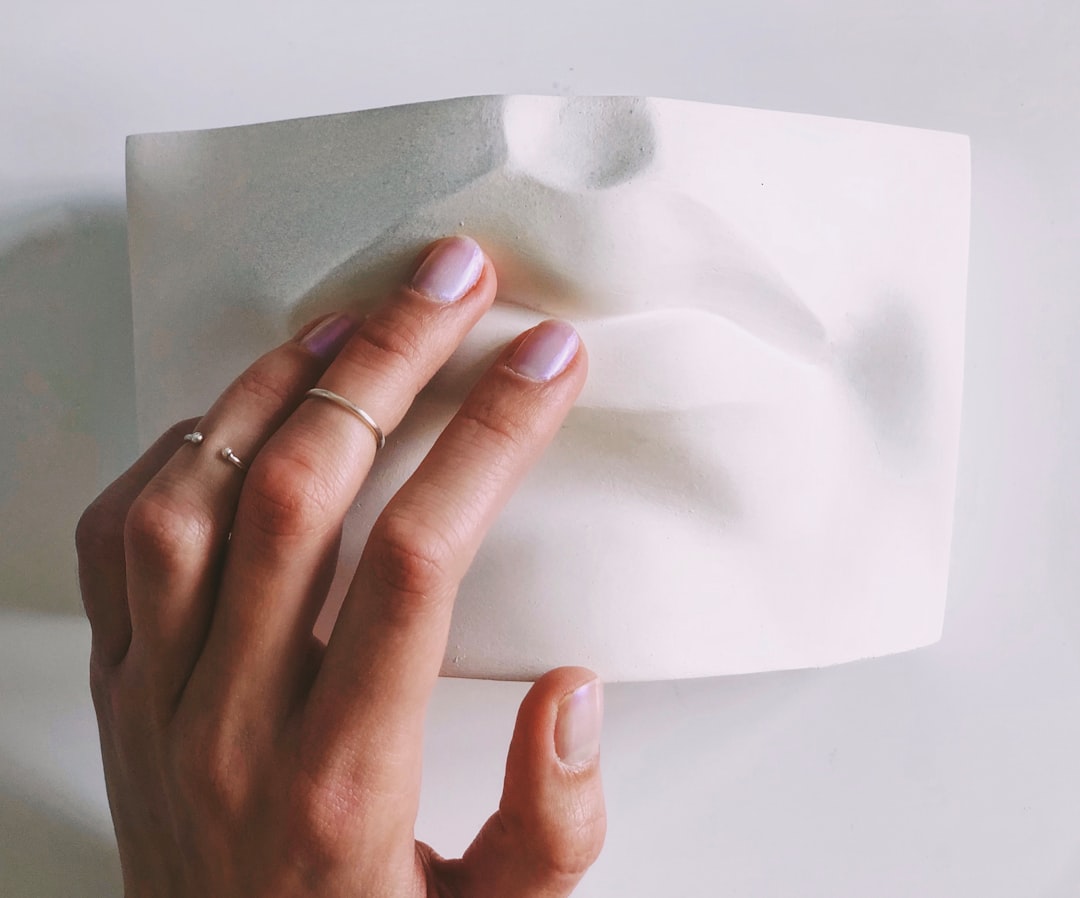 close-up of hands holding paper notes with breathing tips