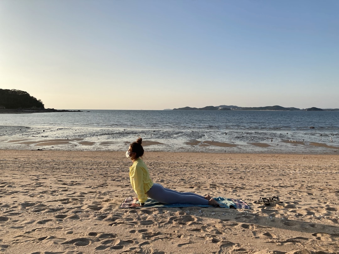 woman practicing yoga at sunrise