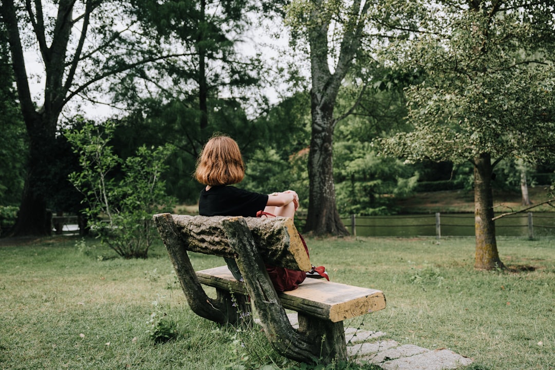 woman sitting cross-legged in nature